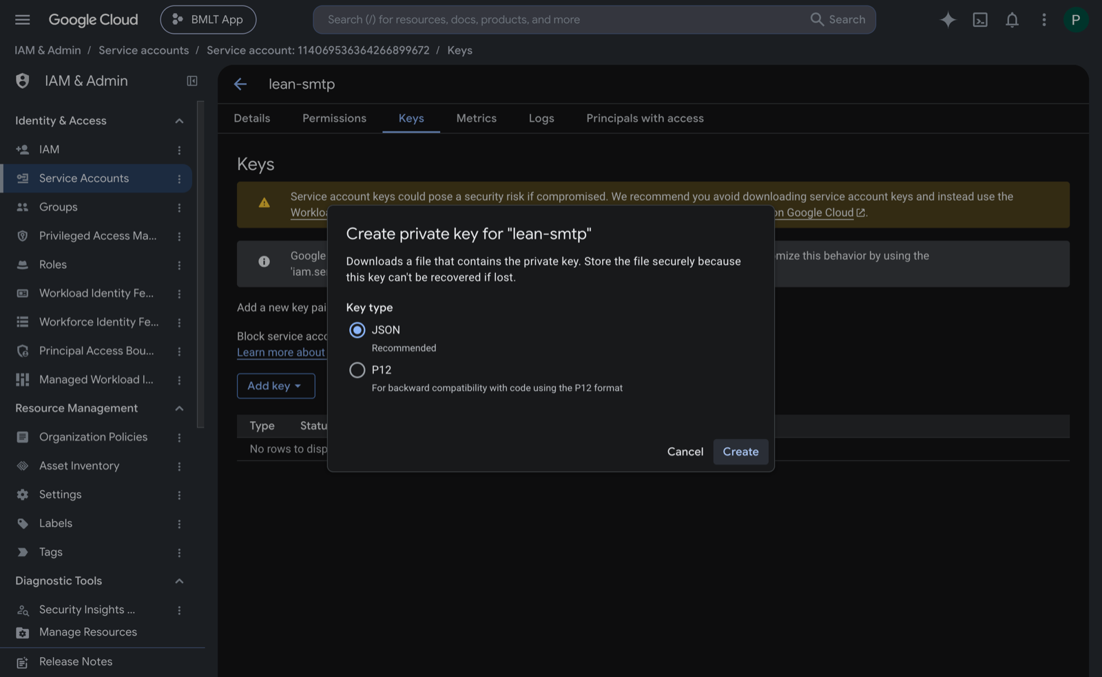 The Keys tab of a service account with the 'Create private key' dialog open, JSON selected as the recommended key type.